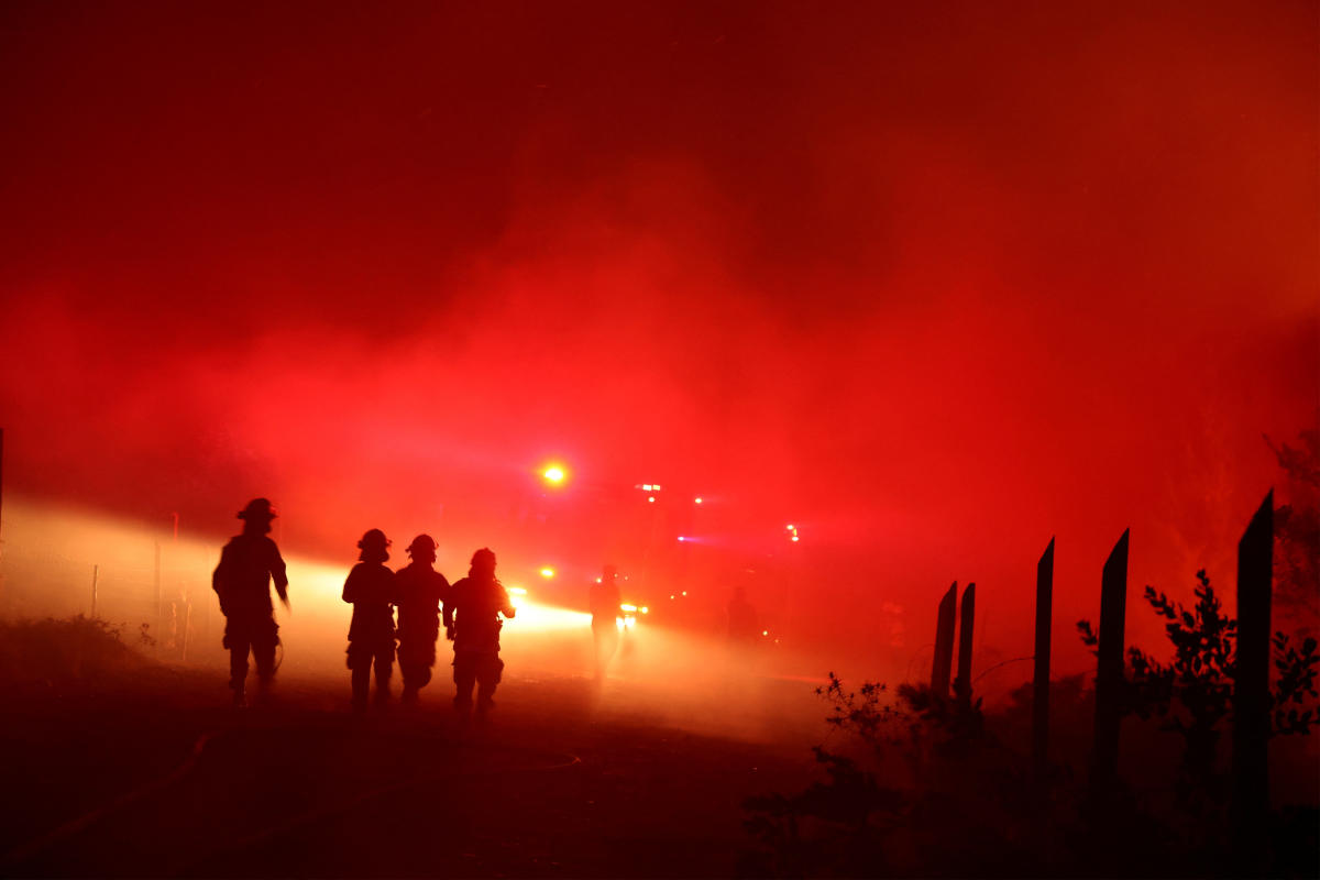 Firefighters attend a wildfire in Chile.