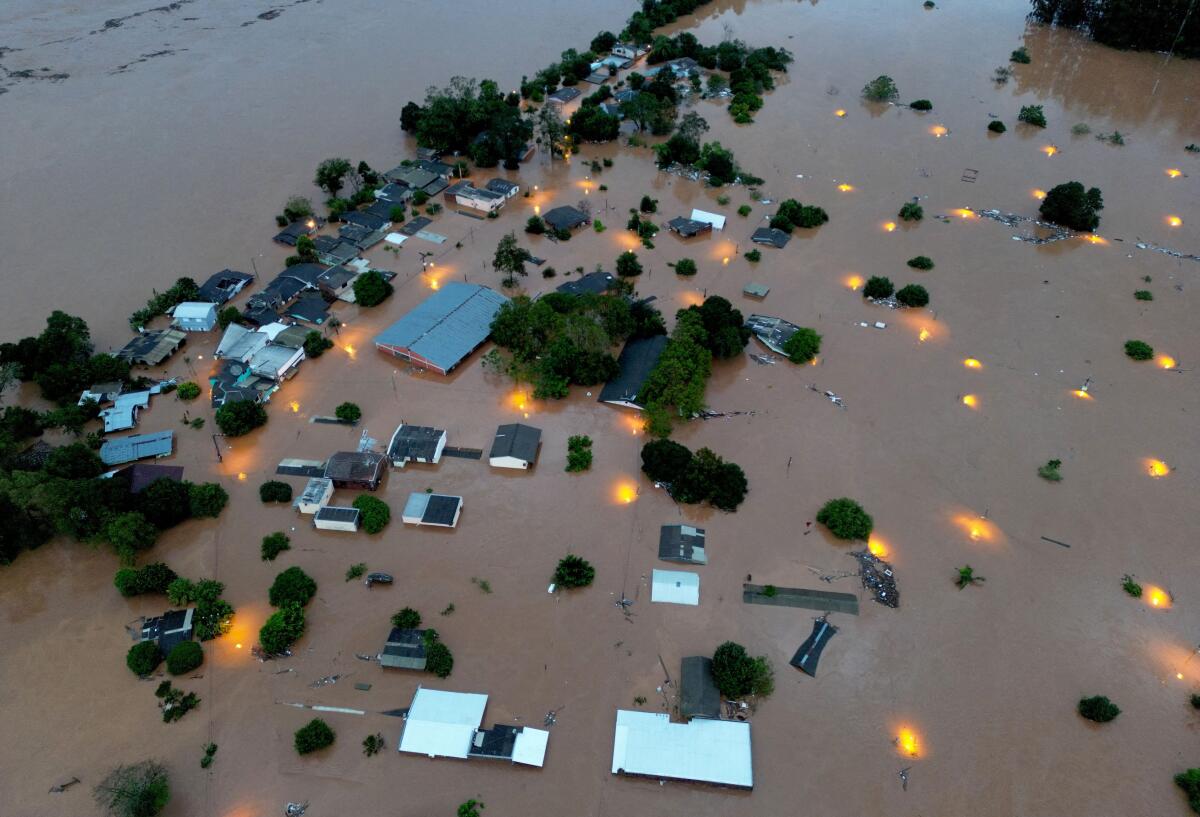 A drone view shows houses in the flooded area.