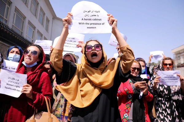 Afghan women's rights defenders and civil activists protest to call on the Taliban for the preservation of their achievements and education, in front of the presidential palace in Kabul, Afghanistan. 