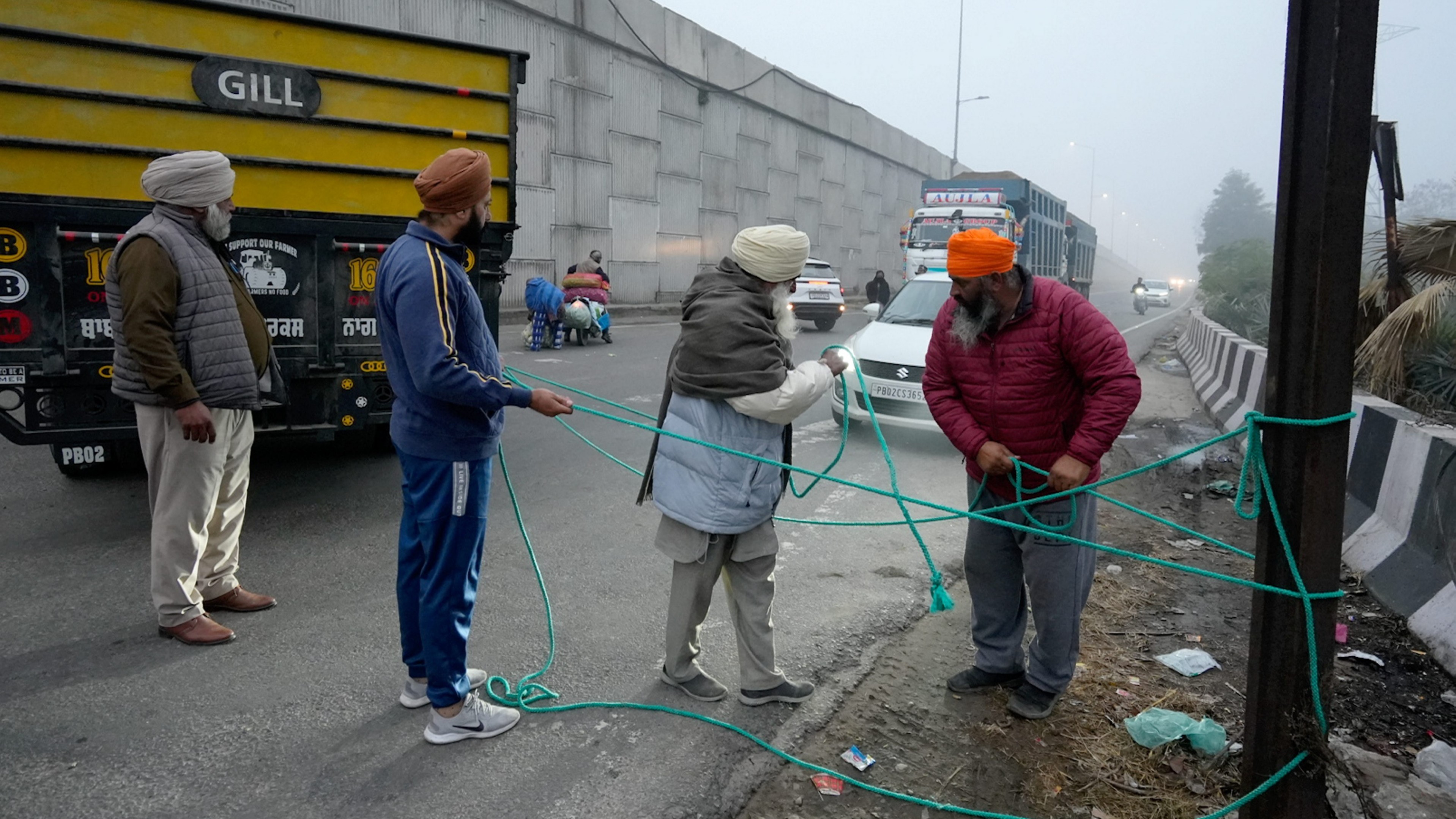 Farmers block a road during the statewide 'bandh' called as part of their ongoing protest in Amritsar.