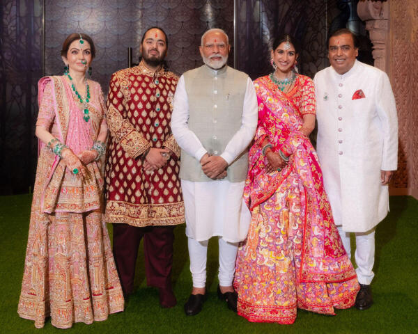 Prime Minister Narendra Modi poses for a photograph with industrialist Mukesh Ambani, his wife Nita Ambani and newlyweds Anant Ambani and Radhika Merchant during the couple's post-wedding ceremony.