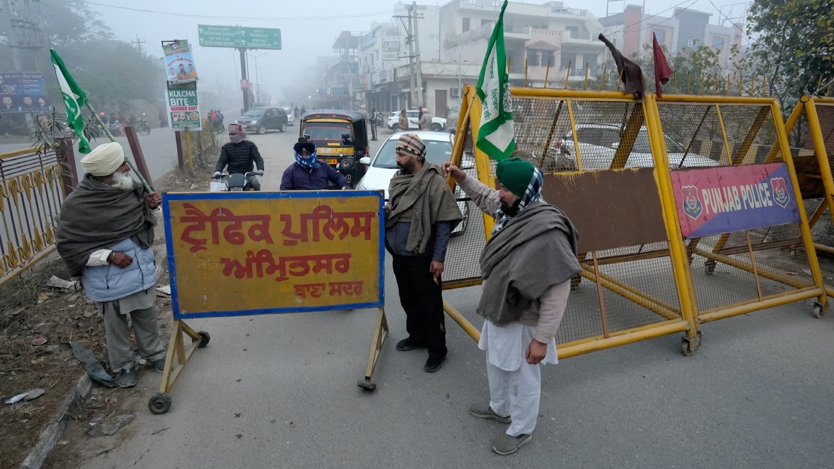 Farmers block a road during the statewide 'bandh' in Amritsar.