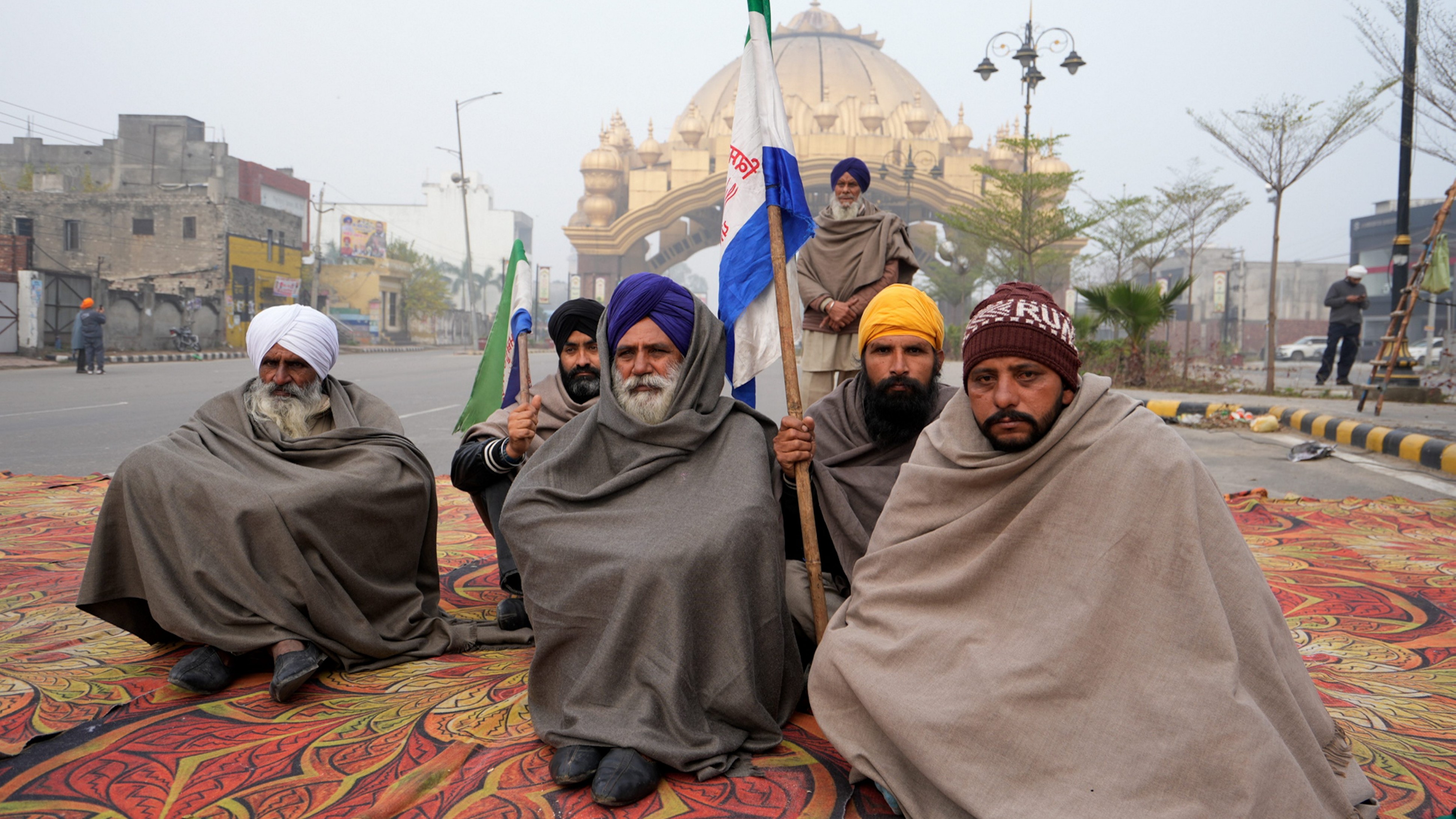 Farmers block a road during the statewide 'bandh' called as part of their ongoing protest near Golden Gate in Amritsar.