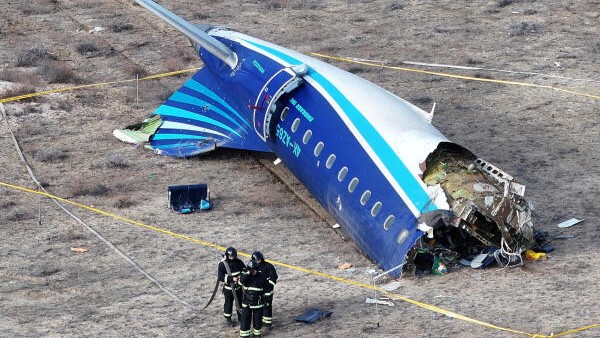 A drone view shows emergency specialists working at the crash site of an Azerbaijan Airlines passenger plane near the city of Aktau, Kazakhstan. 