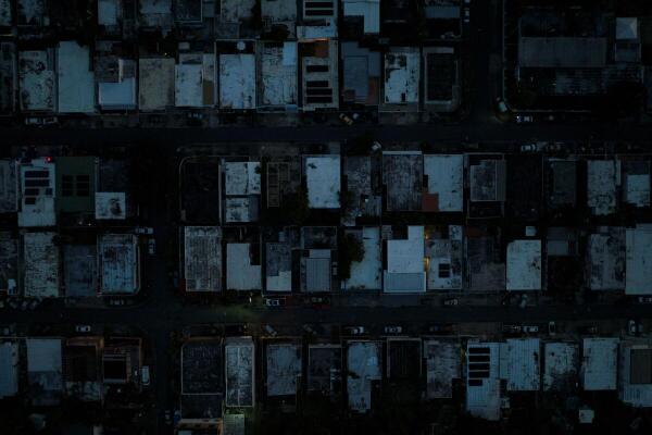 A drone view shows a community as Puerto Ricans were without electricity early on New Year's Eve after a grid failure left nearly all of the island without power, in San Juan, Puerto Rico December 31, 2024.