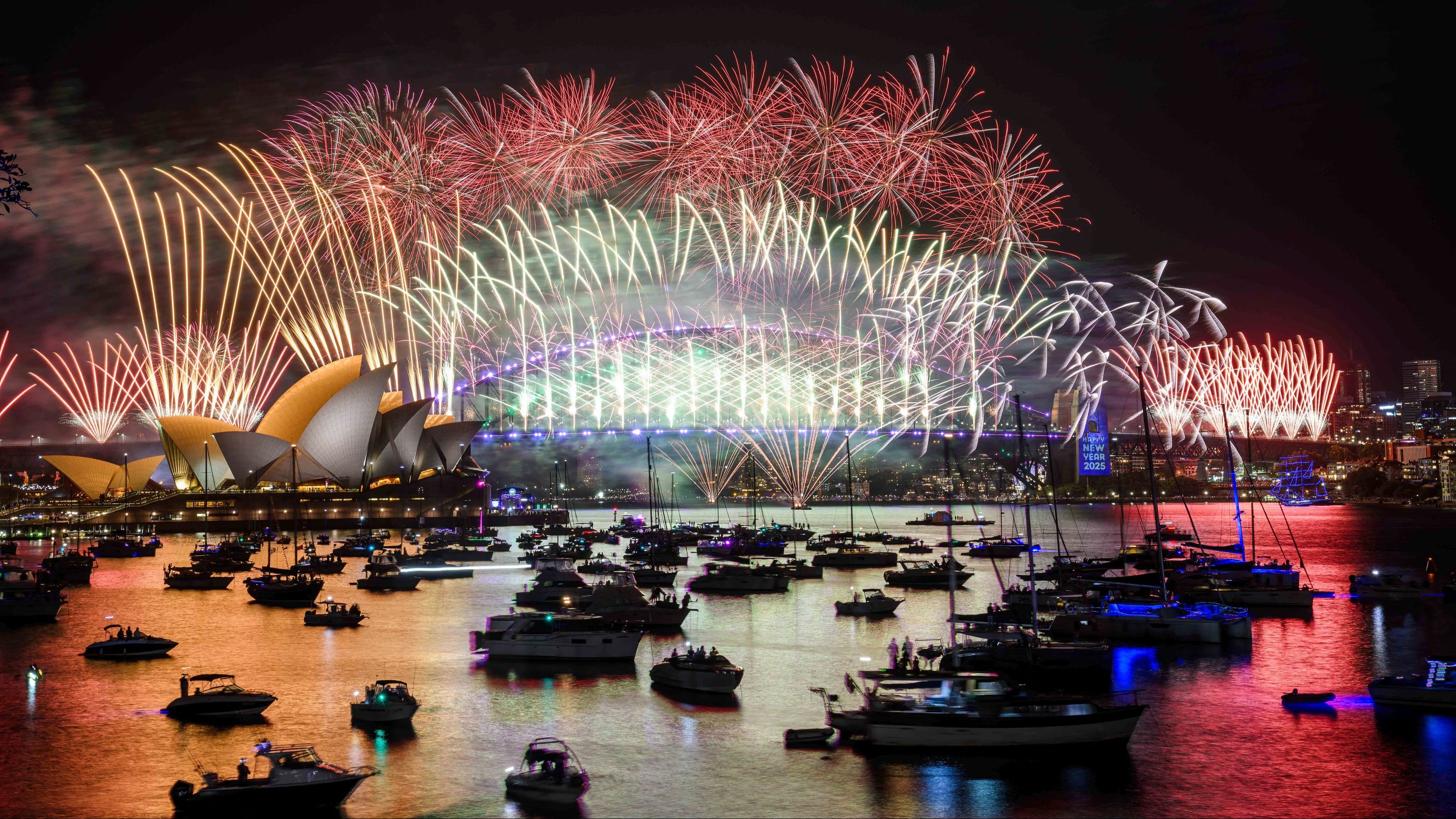 Fireworks explode over the Sydney Opera House and Harbour Bridge during New Year’s Eve celebrations in Sydney, Australia.