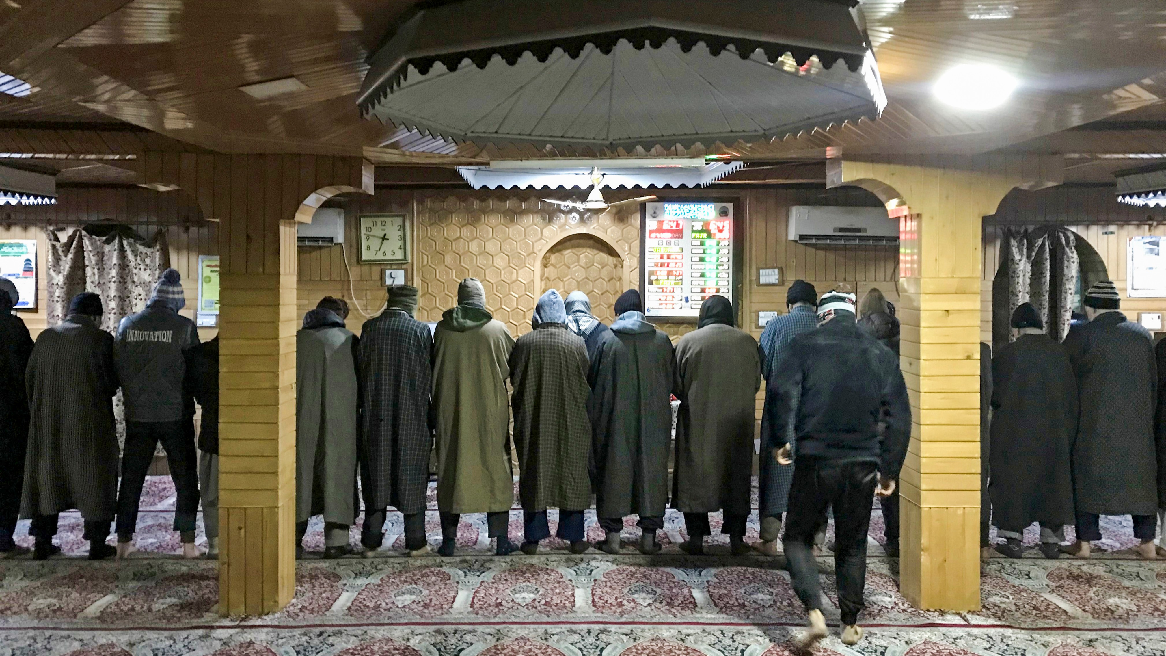 People offer the first Fajr Namaz (early morning prayers) of the New Year 2025 in Srinagar.