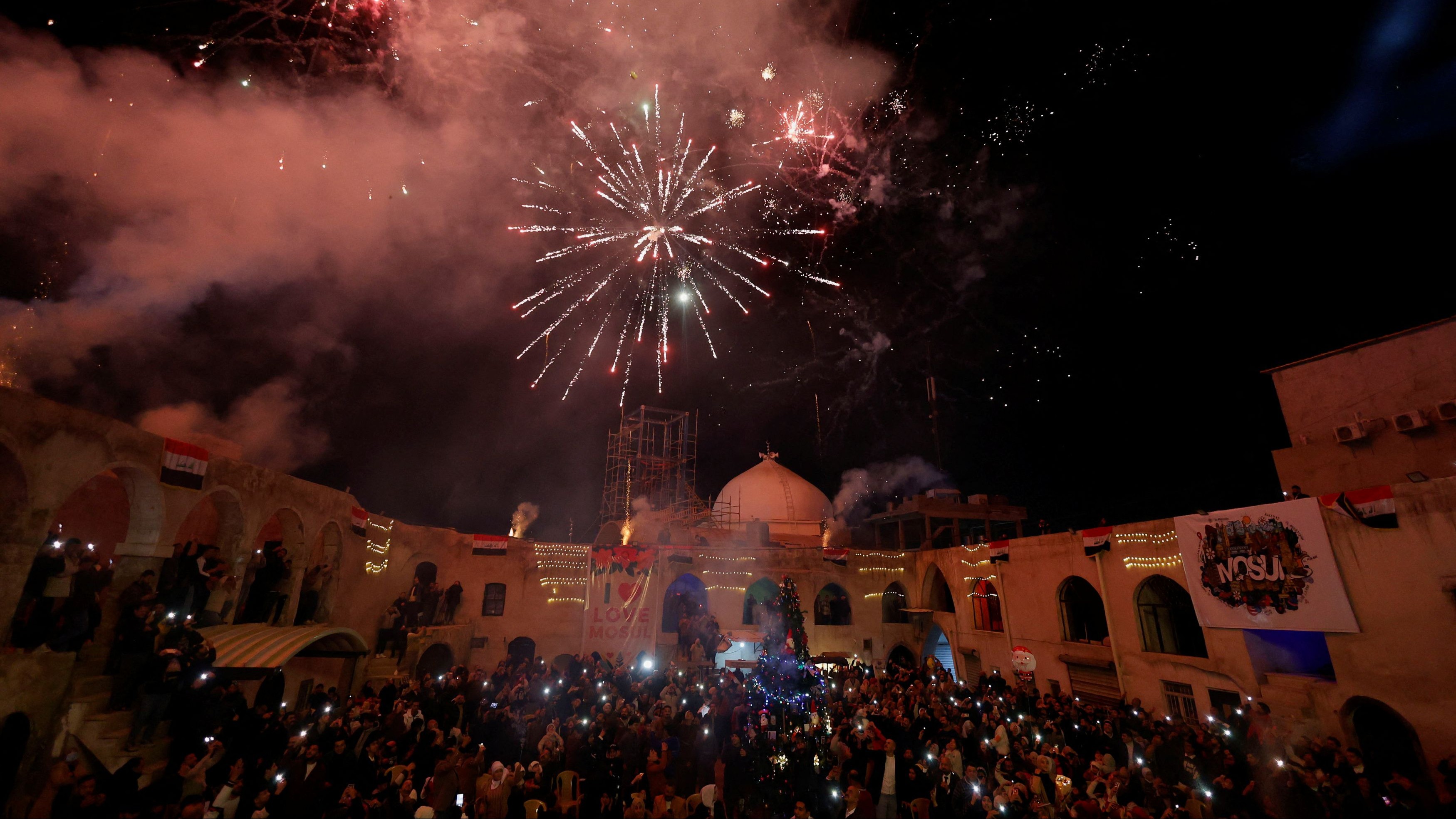 Fireworks explode during New Year celebrations in Mosul, Iraq.