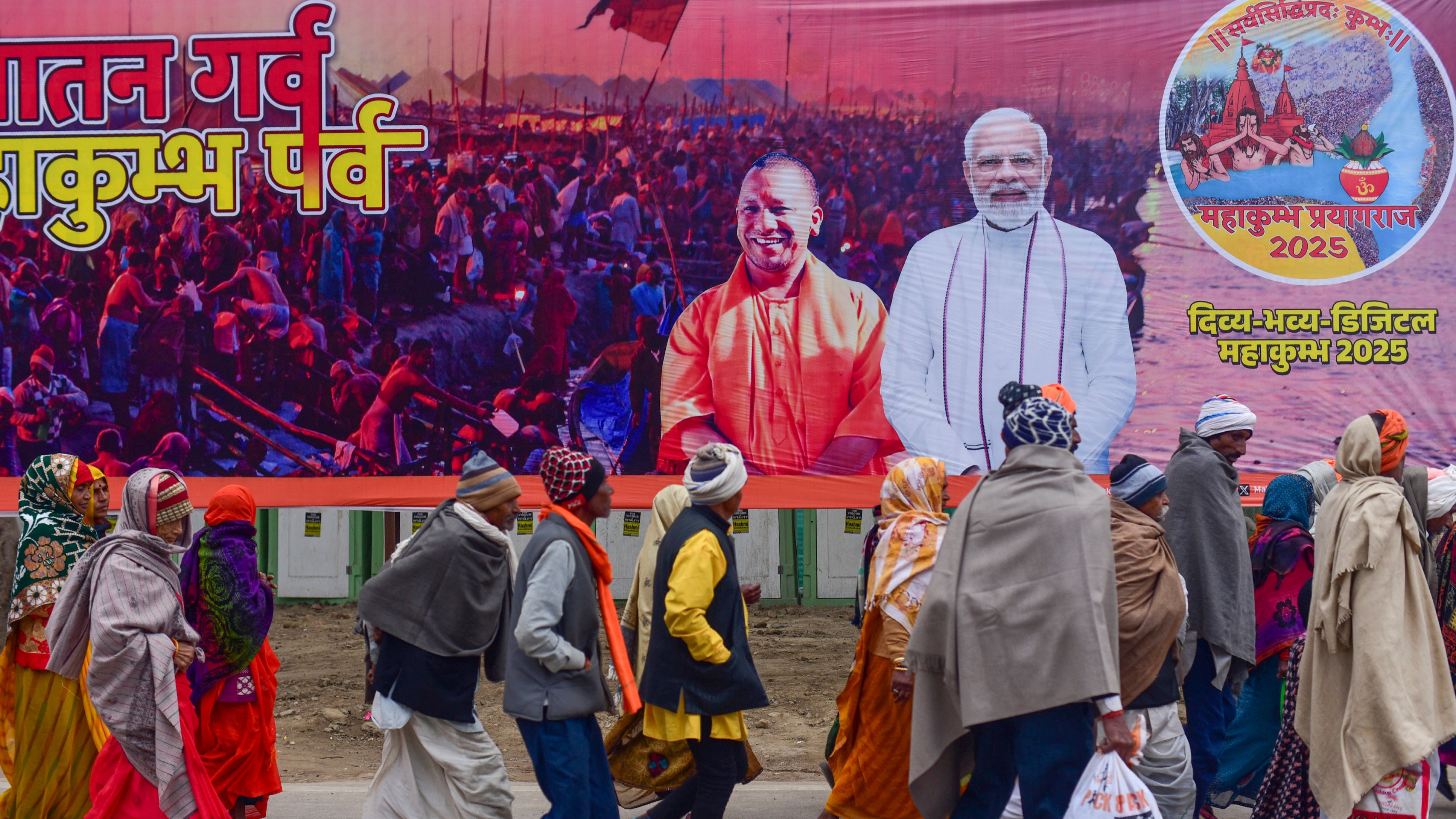 Devotees arrive to take a holy dip in the River Ganga on the first day of the New Year 2025 ahead of Mahakumbh Mela at Sangam in Prayagraj, Uttar Pradesh.