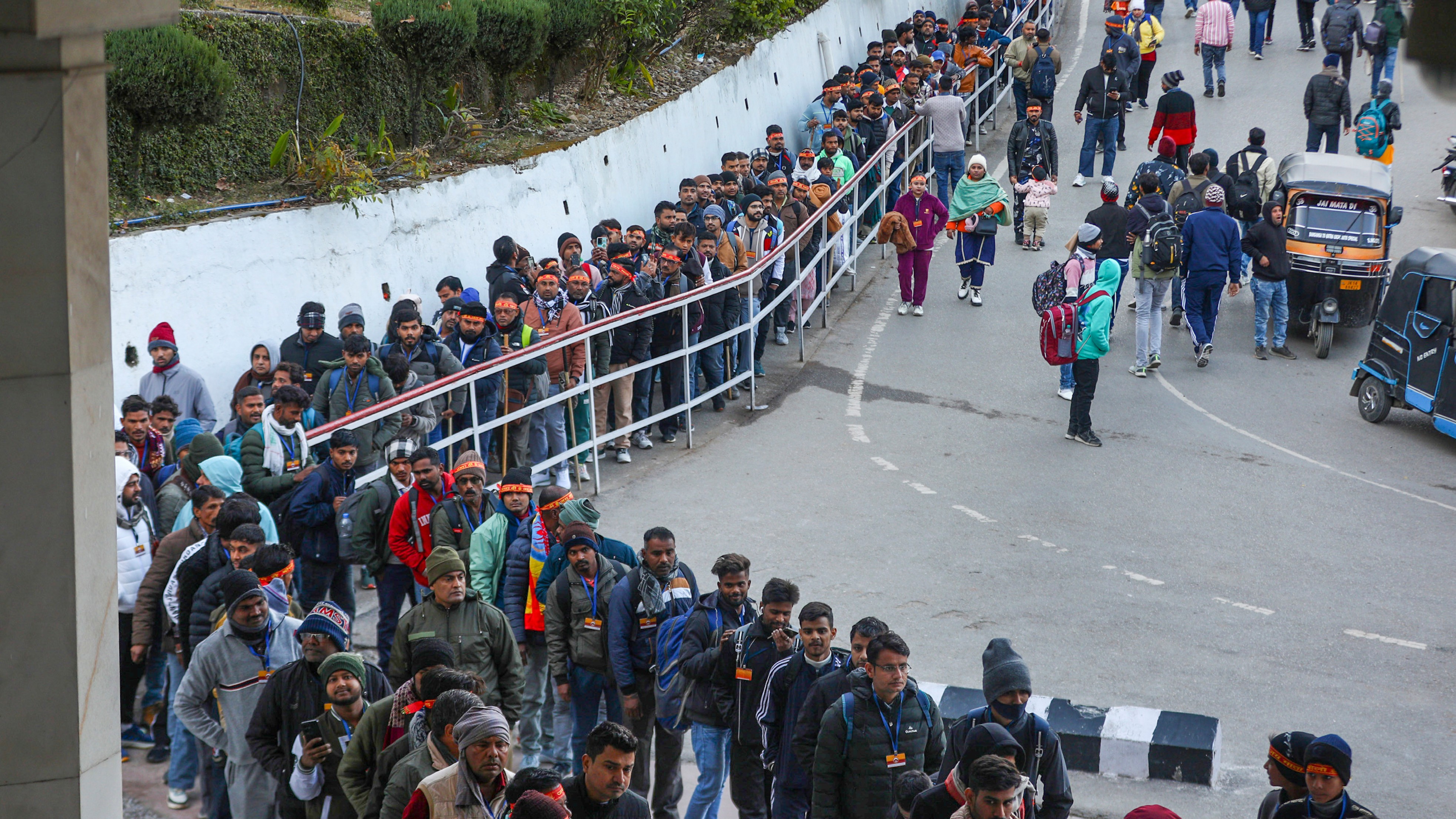Devotees wait to enter the Mata Vaishno Devi Shrine on the first day of New Year 2025 at Katra in Reasi, Jammu &amp; Kashmir.