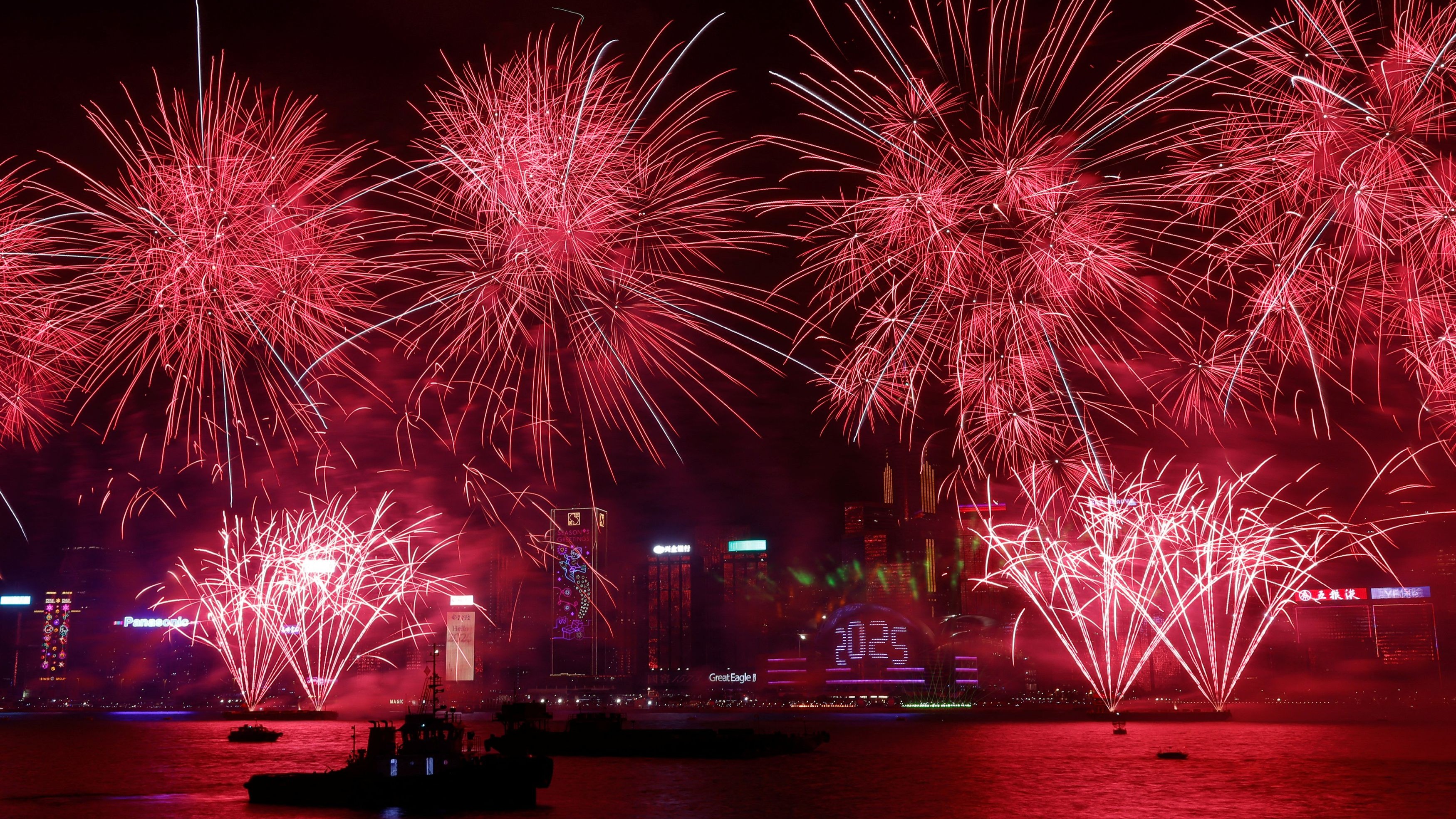 Fireworks explode over Victoria Harbour to celebrate the New Year in China.
