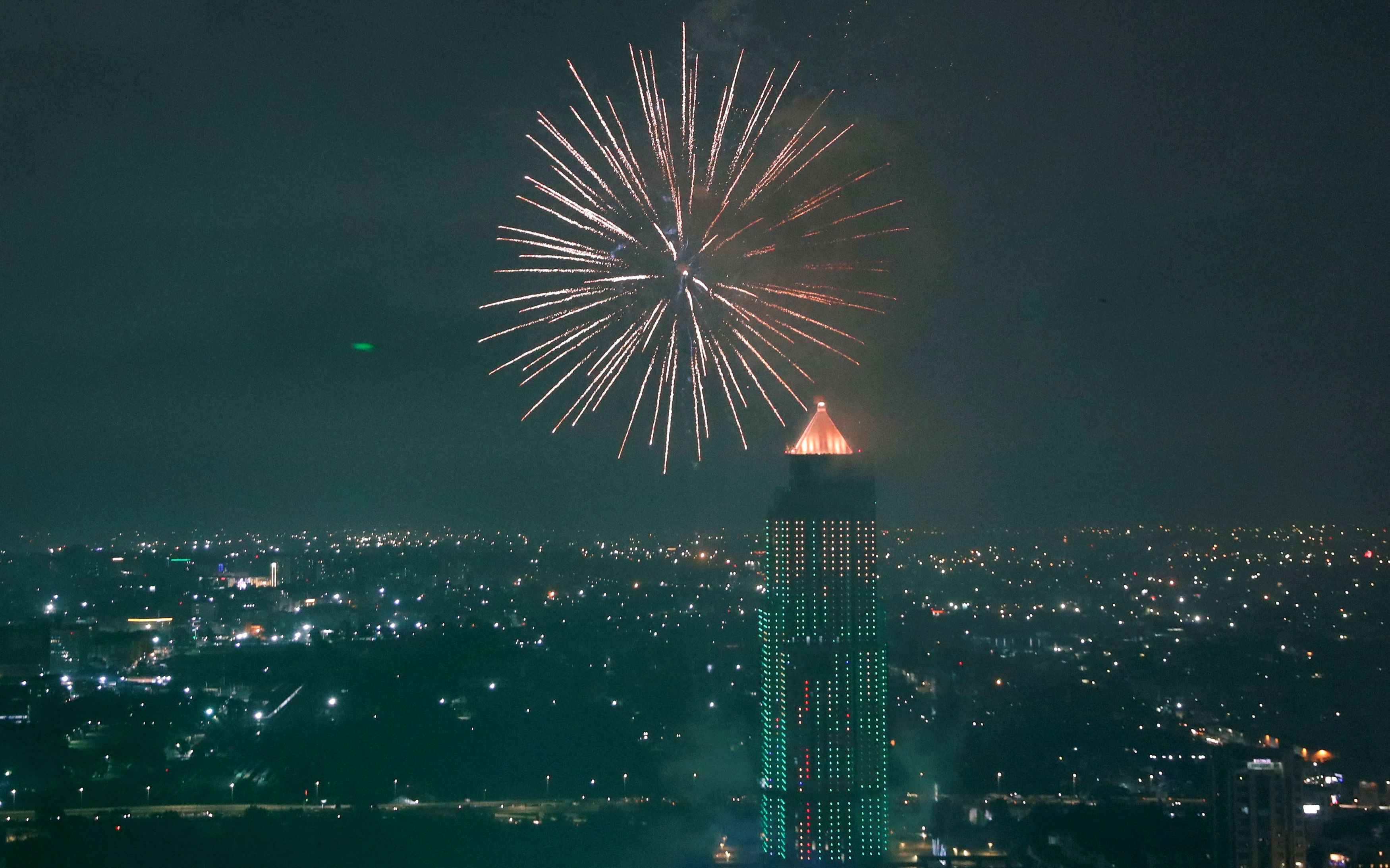 Fireworks explode over the UAP Old Mutual Tower during the New Year's celebrations in Nairobi, Kenya.