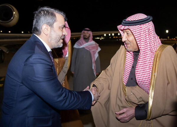 Syria's newly appointed Foreign Minister Asaad Hassan al-Shibani and Saudi Deputy Foreign Minister Waleed Elkhereiji shake hands in Riyadh, Saudi Arabia, January 1, 2025.