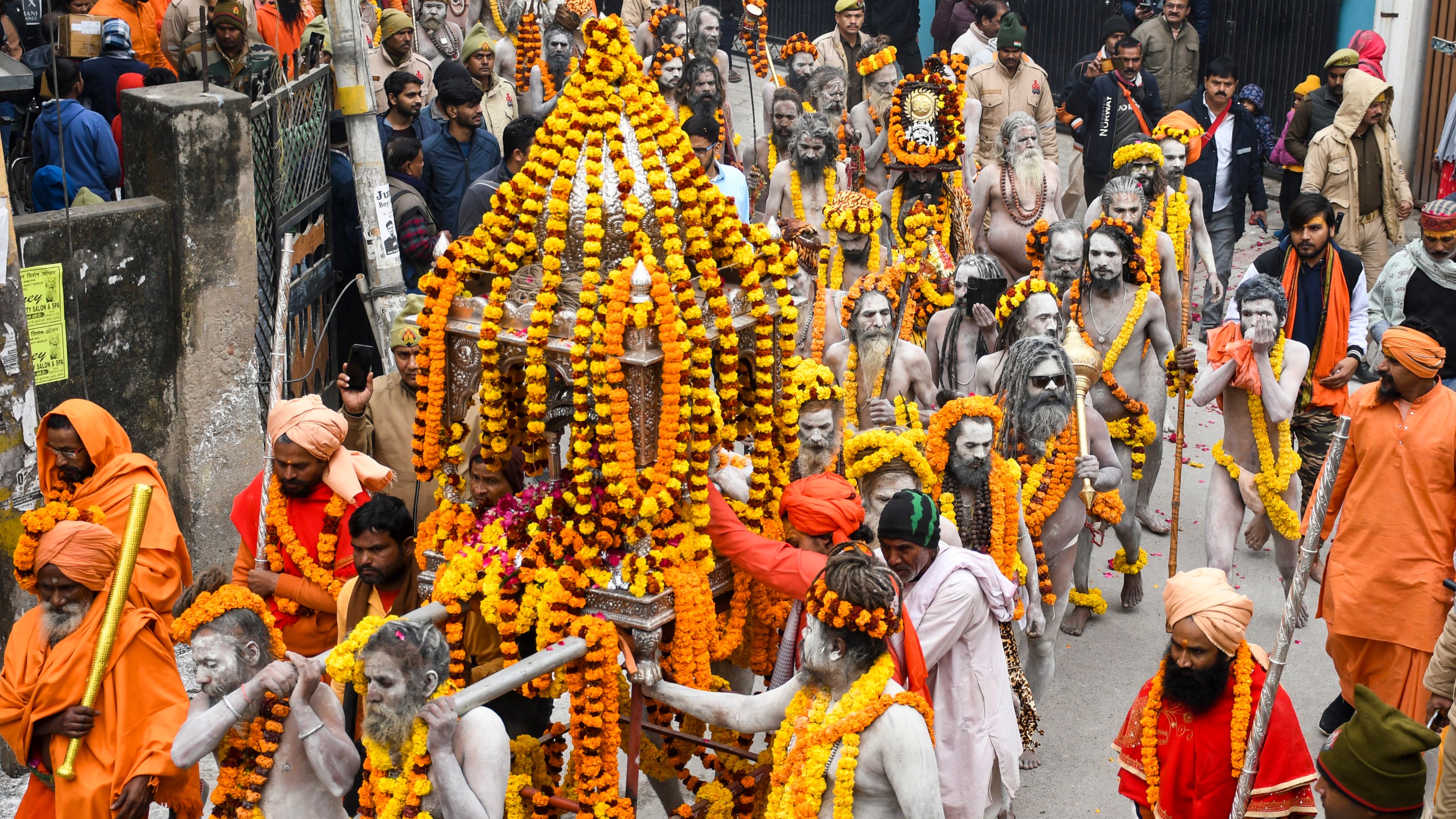 'Naga Sadhus' of ‘Shri Taponidhi Anand Akhara Panchayati’ take part in a procession towards Sangam ahead of Maha Kumbh Mela 2025 in Prayagraj.