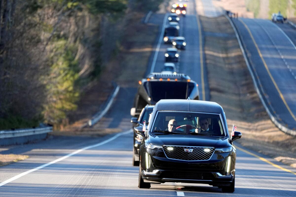 The hearse containing the flag-draped casket of former U.S. President Jimmy Carter is driven from the Lawson Army Airfield, in Fort Moore, GA, to the Maranatha Baptist Church, on the day of his funeral in Plains, Georgia, U.S., January 9, 2025.