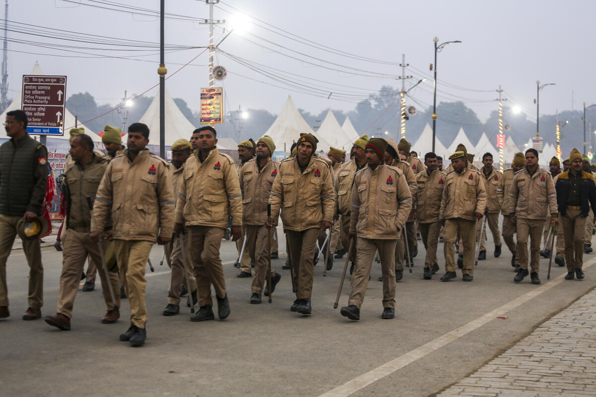 Police personnel patrol amid the Maha Kumbh Mela 2025