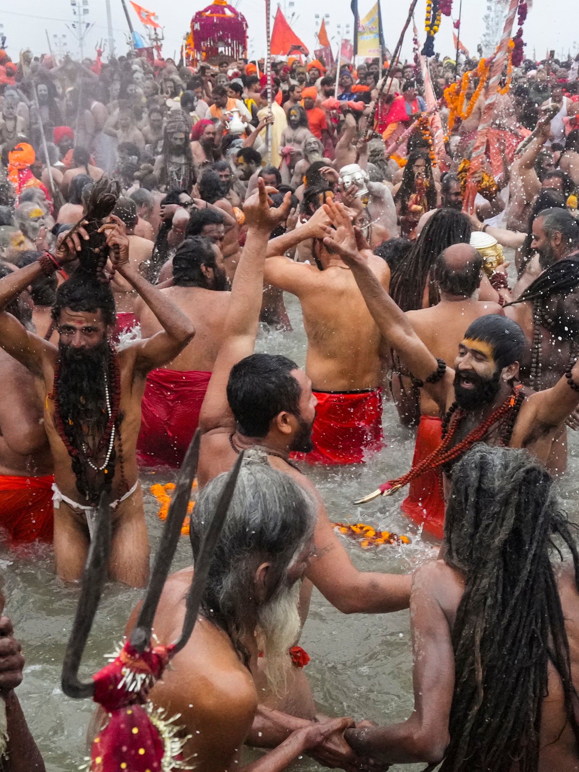 'Sadhus' take a holy dip at the Sangam on the occasion of the 'Makar Sankranti' festival during the Maha Kumbh Mela 2025 in Prayagraj, Uttar Pradesh.