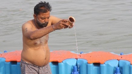 A devotee praying at the Sangam Snan Ghat at the MahaKumbh 2025 at Prayagraj, Uttar Pradesh.
