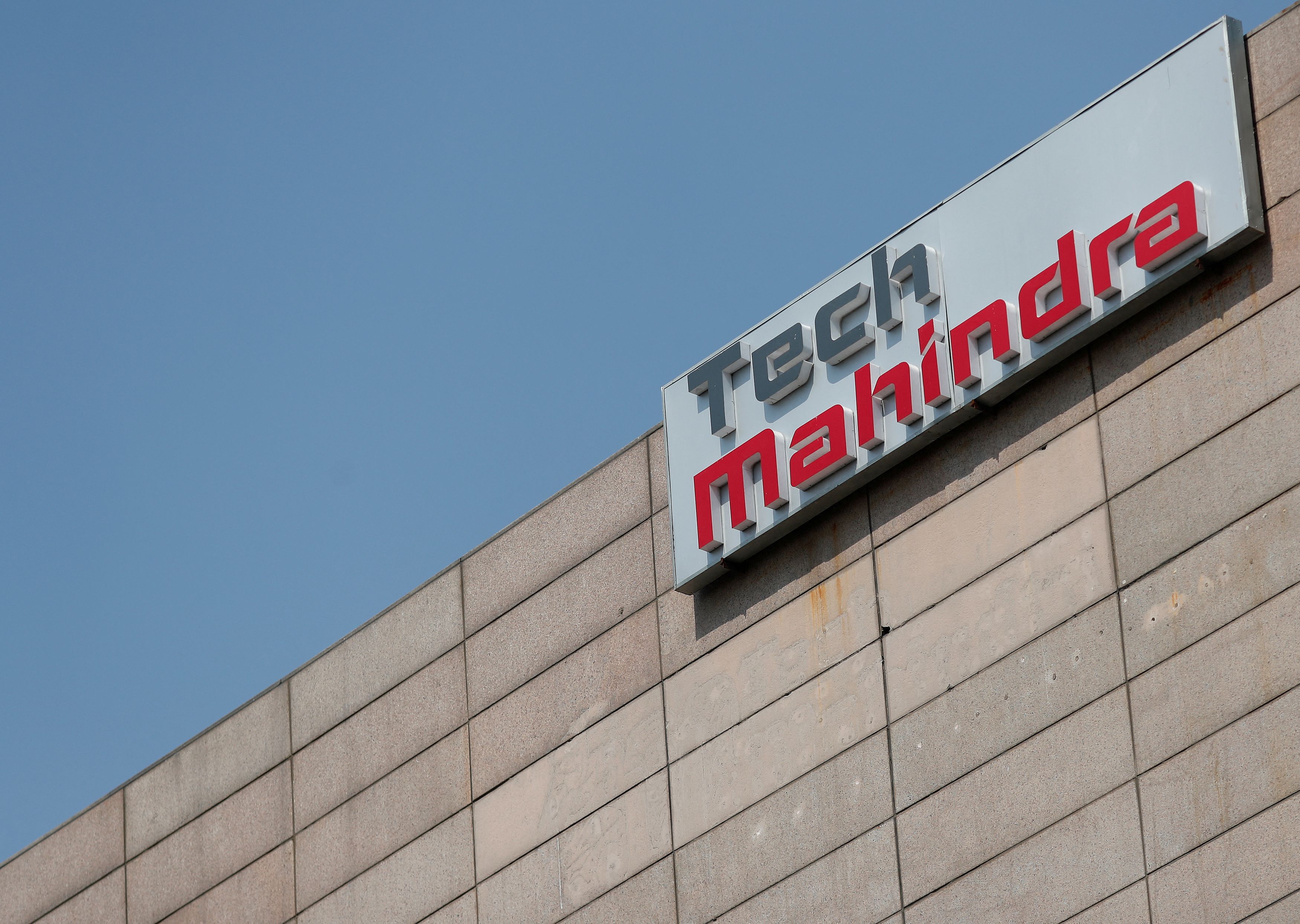 FILE PHOTO: Tech Mahindra logo is seen on its office building in Noida on the outskirts of New Delhi India March 7 2019. Picture taken March 7 2019. 