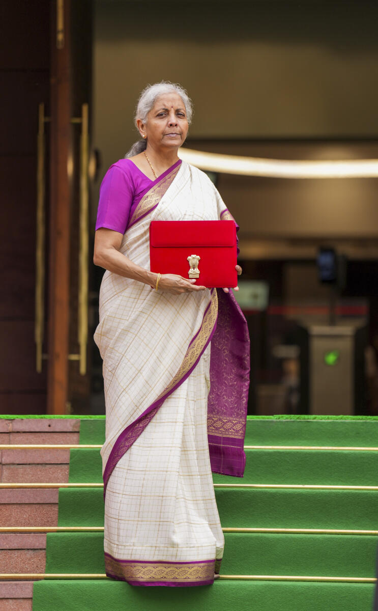  Union Finance Minister Nirmala Sitharaman with a red pouch carrying the Budget documents arrives at the Parliament to present the Union Budget 2024-25,