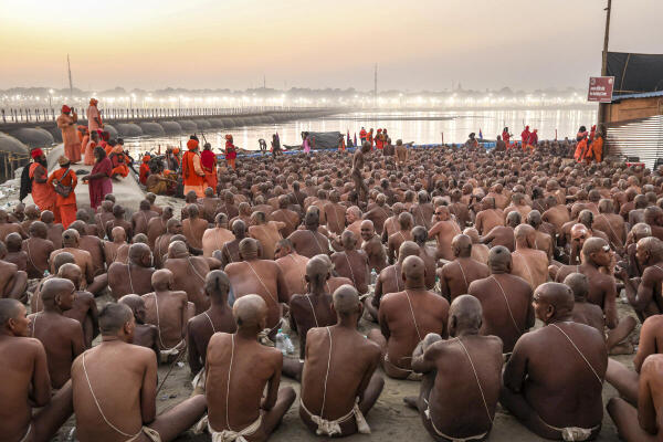 Newly initiated 'Naga Sadhus' perform rituals during the ongoing ‘Maha Kumbh Mela’ festival, in Prayagraj, Uttar Pradesh.