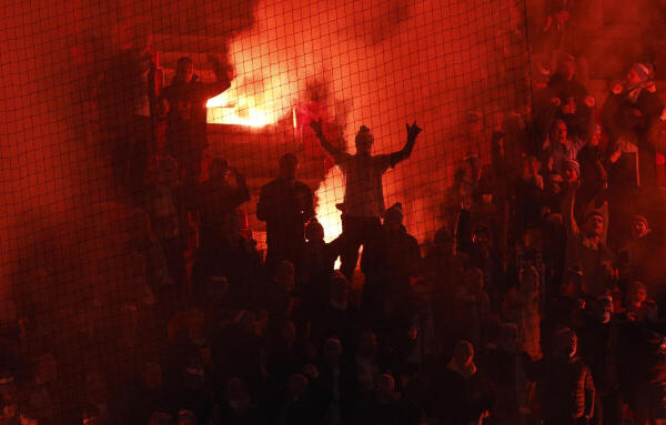Malmo FF fans let off flares in the stands.