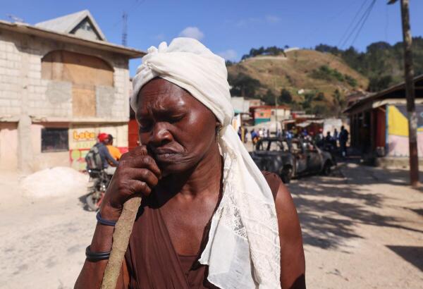 Resident Anicia Aneus talks to the press as she claims that 7 members of her family were kidnapped by gang members in the Kenscoff neighborhood, in Port-au-Prince, Haiti.