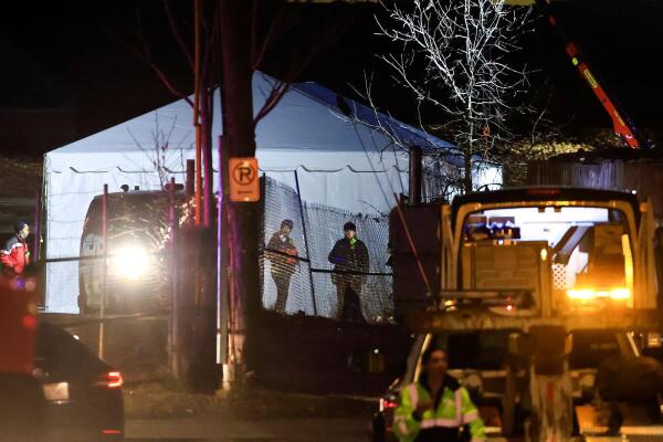DC Fire and EMS members are seen at the Anacostia River where they are holding the recovery operations near the Ronald Reagan Washington National Airport, in the aftermath of the collision of American Eagle flight 5342 and a Black Hawk helicopter that crashed into the Potomac River, in Washington.
