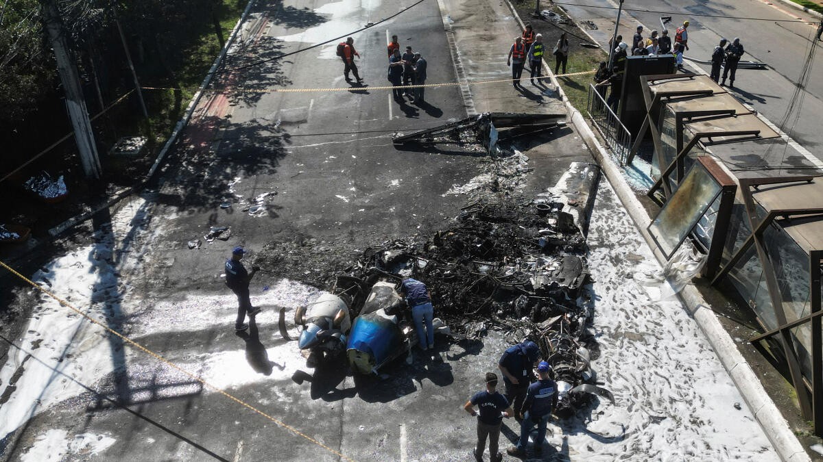 Two dead as small plane crashes into bus on busy Sao Paulo avenue