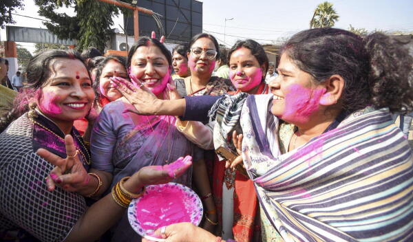BJP women leaders celebrate party's victory in the Delhi Assembly elections, in Patna.
