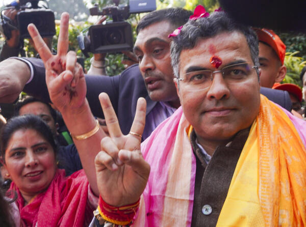 BJP candidate from New Delhi assembly constituency Parvesh Verma shows victory sign upon reaching his residence, amid the counting of votes for the Delhi Assembly elections, in New Delhi, Saturday, Feb. 8, 2025. 