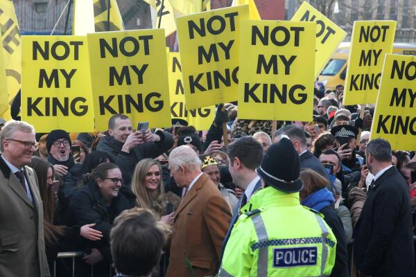 Britain's King Charles interacts with well-wishers as anti-monarchy demonstrators display, "Not my king", posters, during a visit to Middlesbrough, Britain, February 13, 2025.