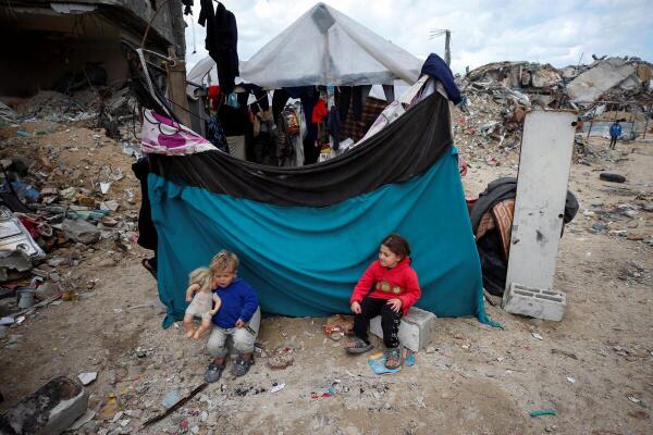 Palestinian children play near the rubble of their destroyed house, amid a ceasefire between Israel and Hamas, in Jabalia refugee camp in the northern Gaza Strip February 13, 2025.