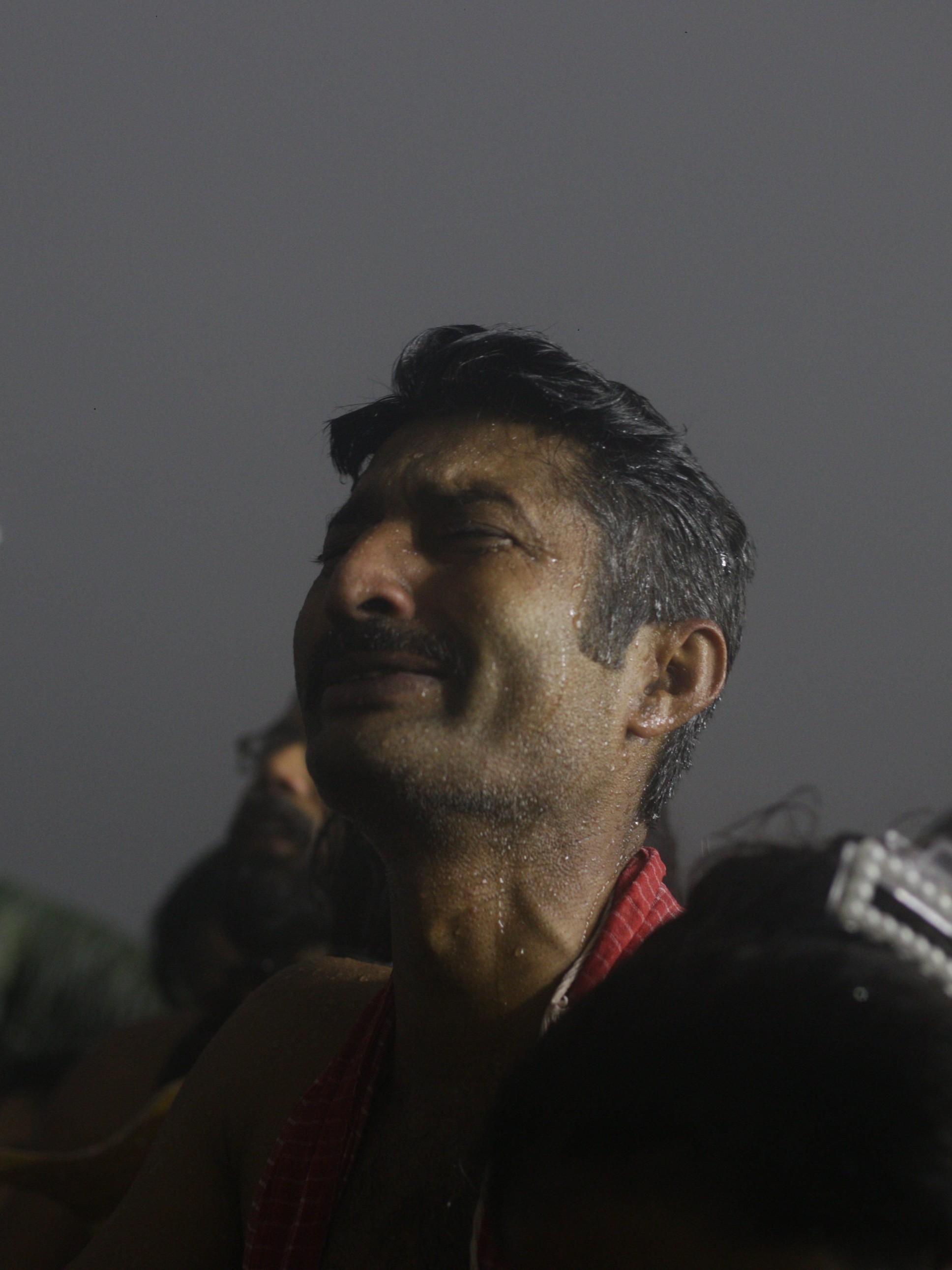 A devotee prays while taking a holy dip at the Sangam, at the MahaKumbh 2025, at Prayagraj, Uttar Pradesh, January 14.