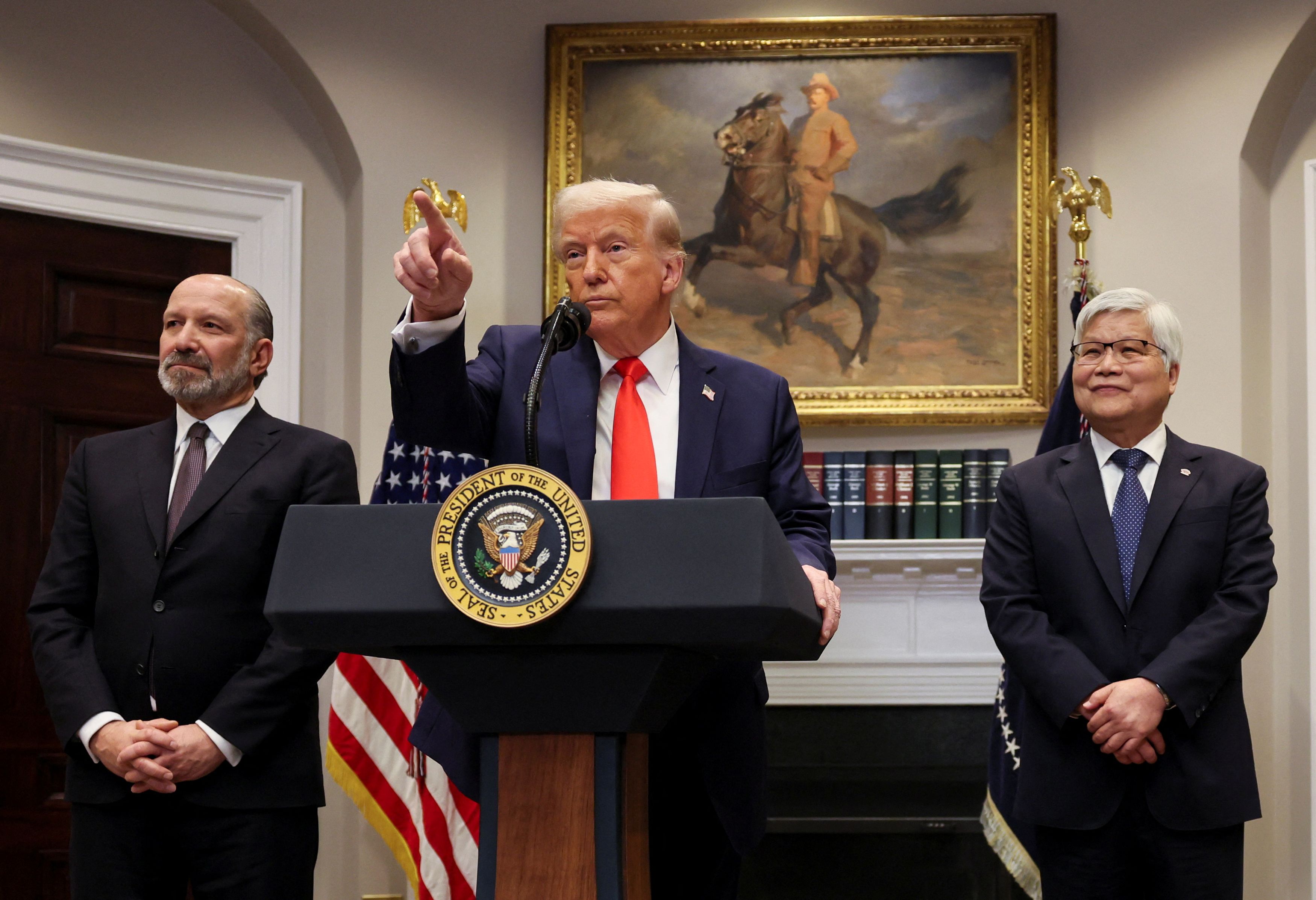 U.S. President Donald Trump speaks next to C.C. Wei, Chairman and CEO of TSMC and Commerce Secretary Howard Lutnick, as they make an announcement about an investment from Taiwan Semiconductor Manufacturing Company (TSMC), in the Roosevelt Room at the White House in Washington, D.C., U.S., March 3, 2025.