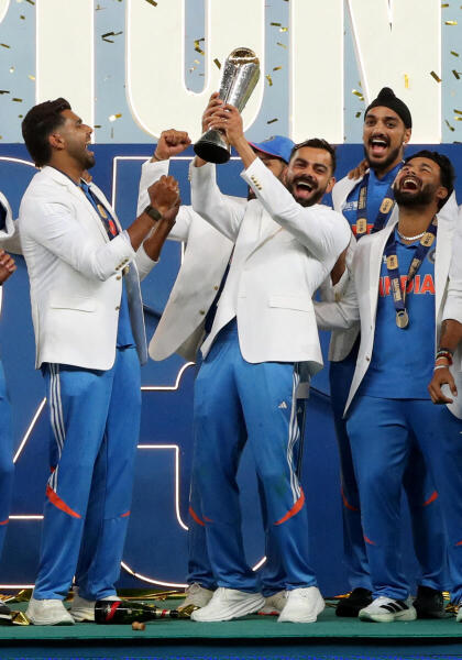 Virat Kohli lifts the trophy as he celebrates winning the ICC Men's Champions Trophy
