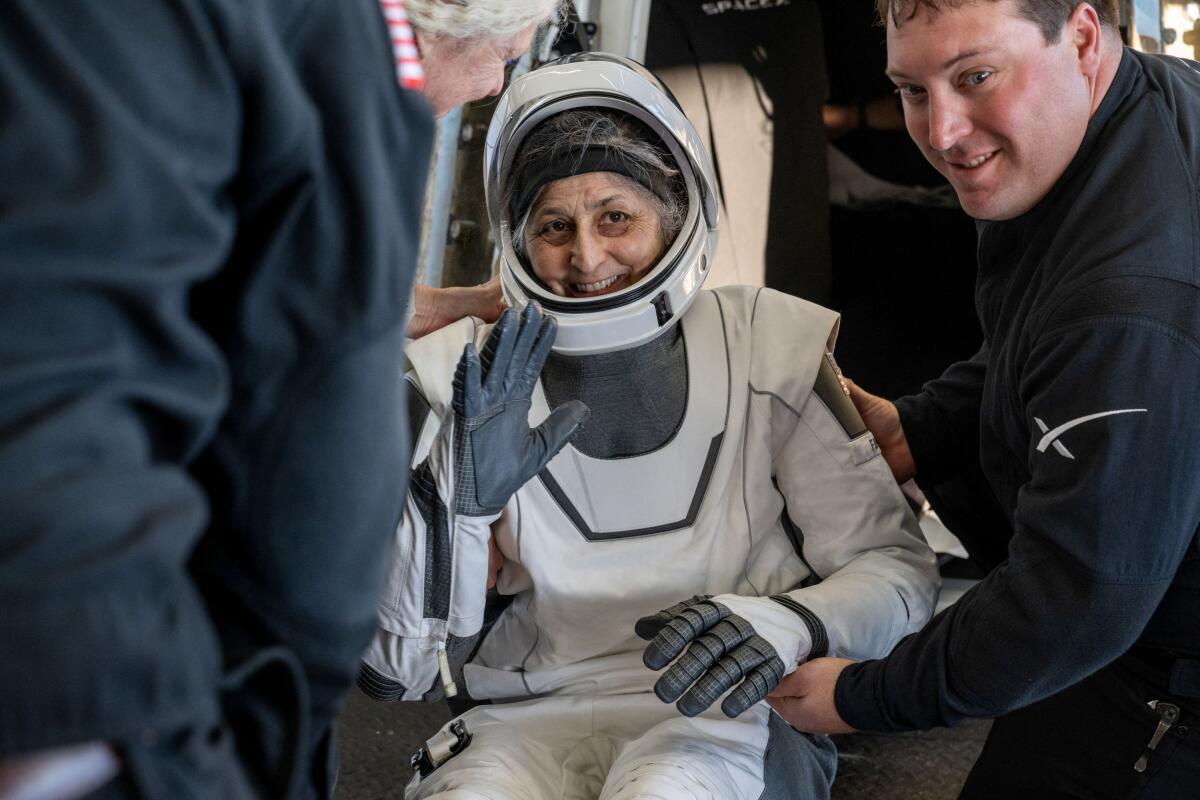 NASA astronaut Suni Williams is helped out of a SpaceX Dragon spacecraft onboard the SpaceX recovery ship MEGAN after she, NASA astronaut Nick Hague, and Butch Wilmore, and Roscosmos cosmonaut Aleksandr Gorbunov landed in the water off the coast of Tallahassee, Florida, Tuesday, March 18, 2025.