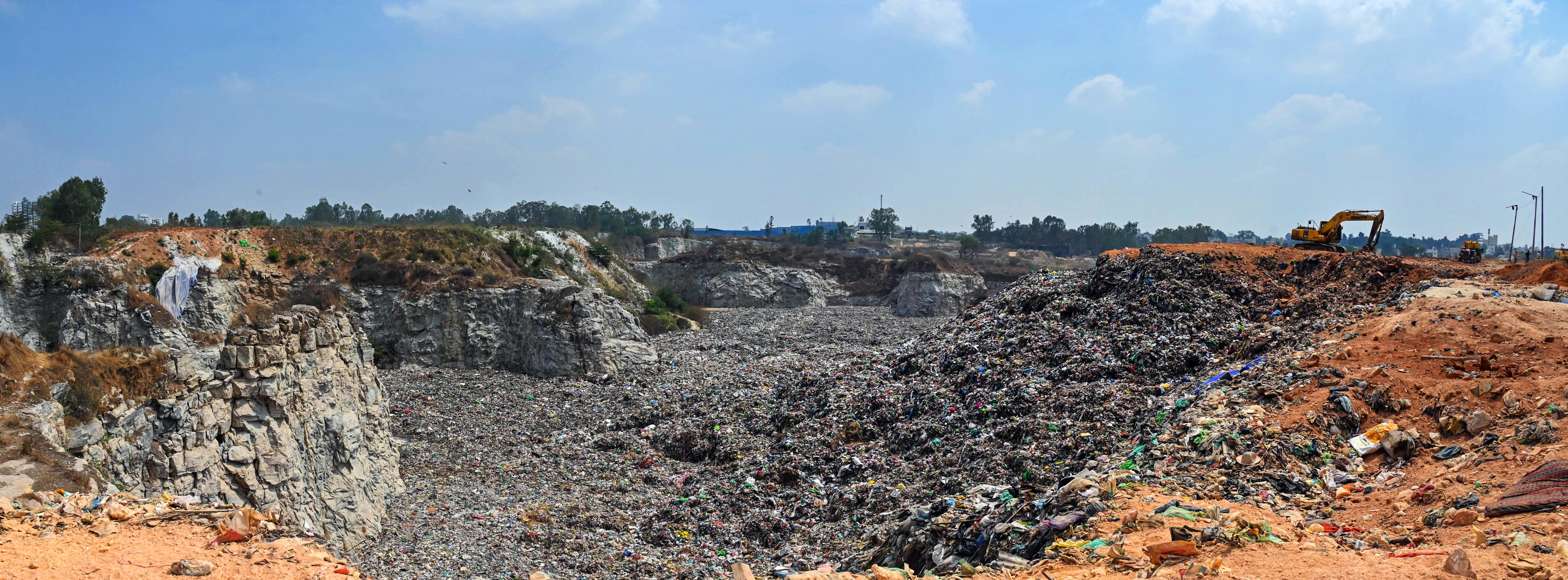 Vehicles carrying garbage line up on the road leading to the landfill in Kannur. Leachate falling on such roads can attract flies and mosquitoesleading to contamination and public health hazards. 