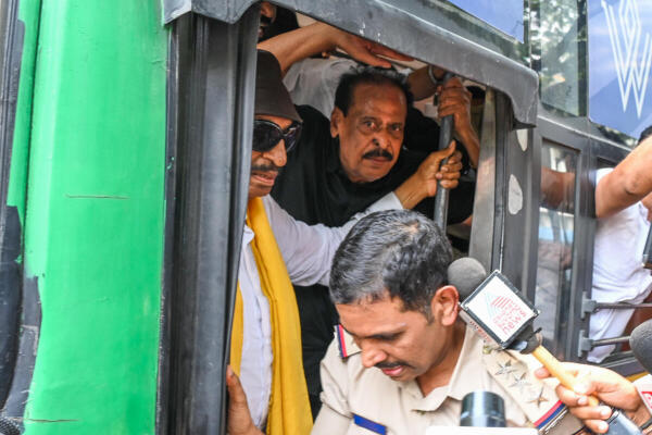 Kannada activist Vatal Nagaraj detained by police due to Karnataka Bandh call by pro-Kannada organisations near Town Hall in Bengaluru.