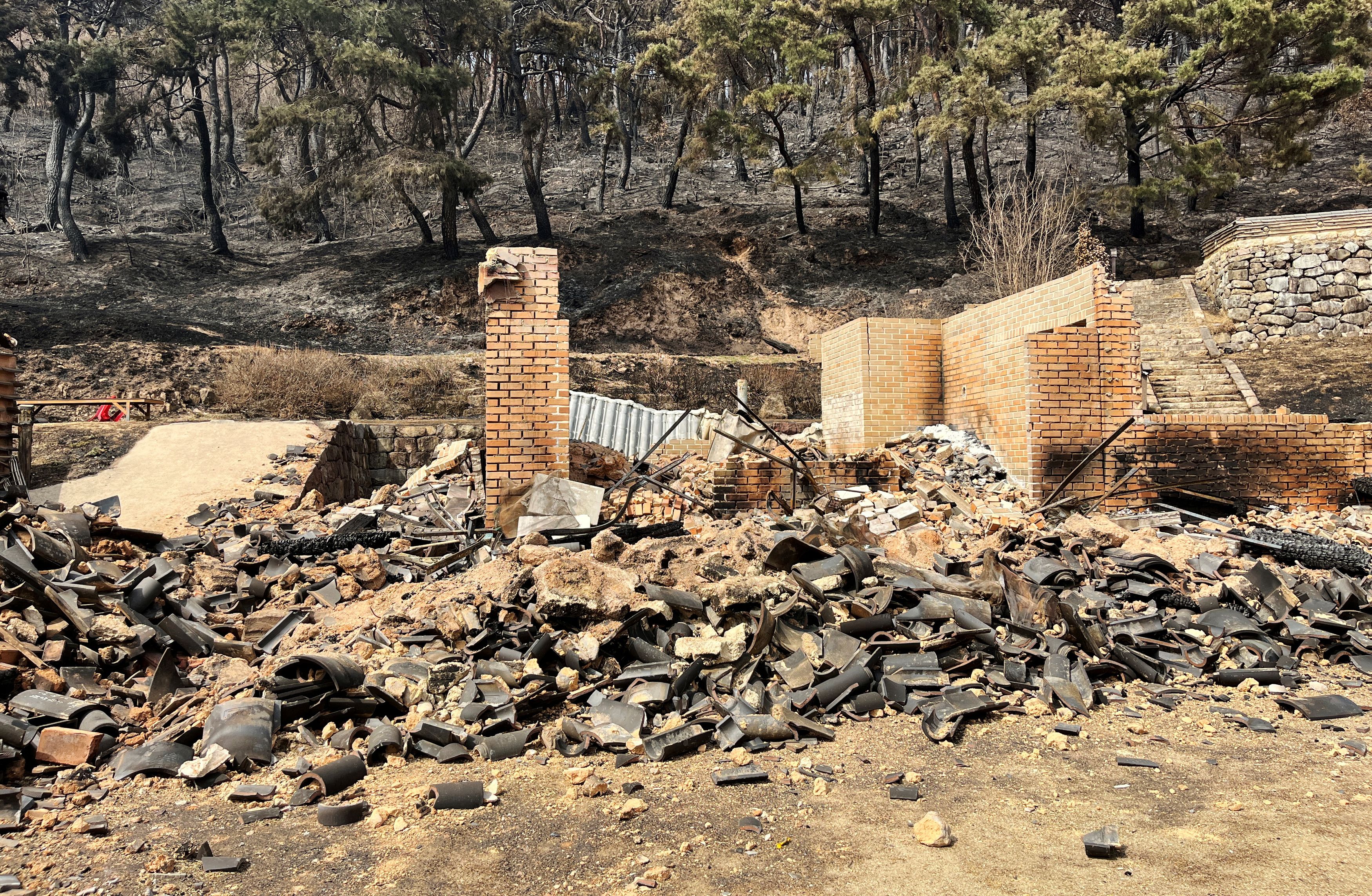 Burnt Unramsa temple is pictured after a wildfire devastated the area in Uiseong, South Korea, March 25, 2025.    