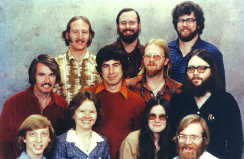 Microsoft's co-founders Bill Gates (bottom extreme left) and Paul Allen (bottom extreme right) with employees.