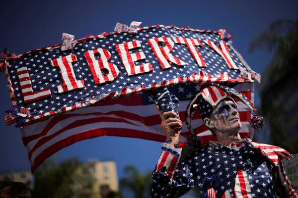 Dan Didi takes part in a 'Hands Off!' protest against US President Donald Trump and his adviser Elon Musk, in Los Angeles, California.