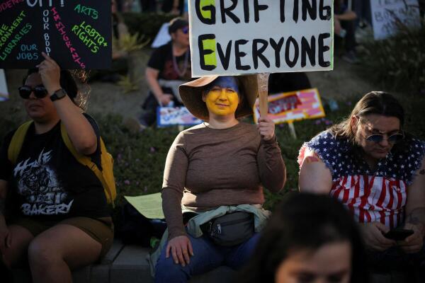Demonstrators take part in a 'Hands Off!' protest against US President Donald Trump and his adviser Elon Musk, in Los Angeles, California.