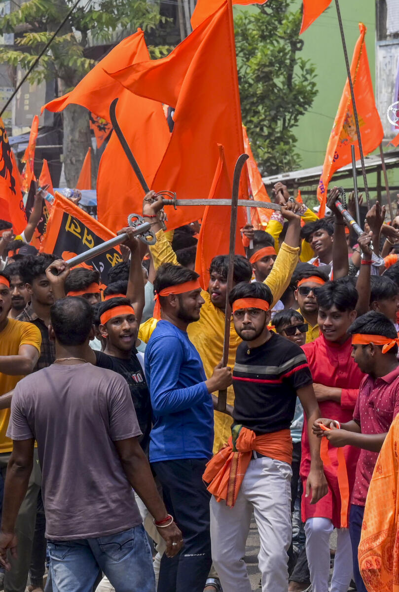 People take part in a religious procession on the occasion of Ram Navami, in Malda