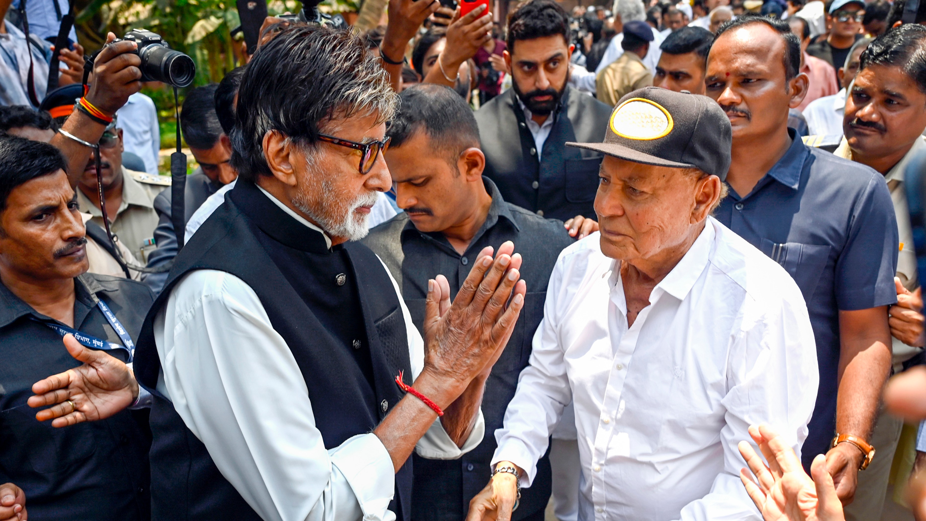 Amitabh Bachchan and Salim Khan greet each other at Manoj Kumar's funeral.