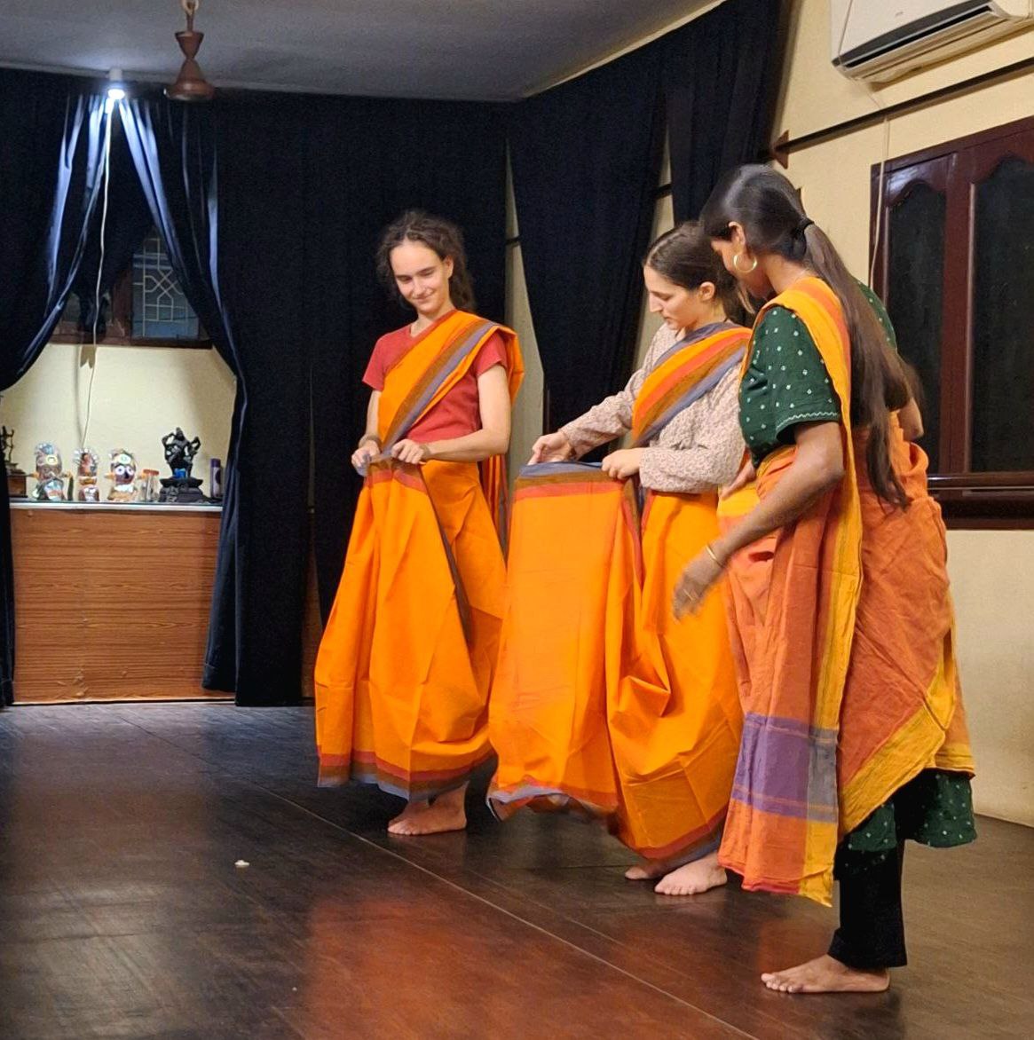 Maria and Flora take saree lessons at a dance studio in Puducherry