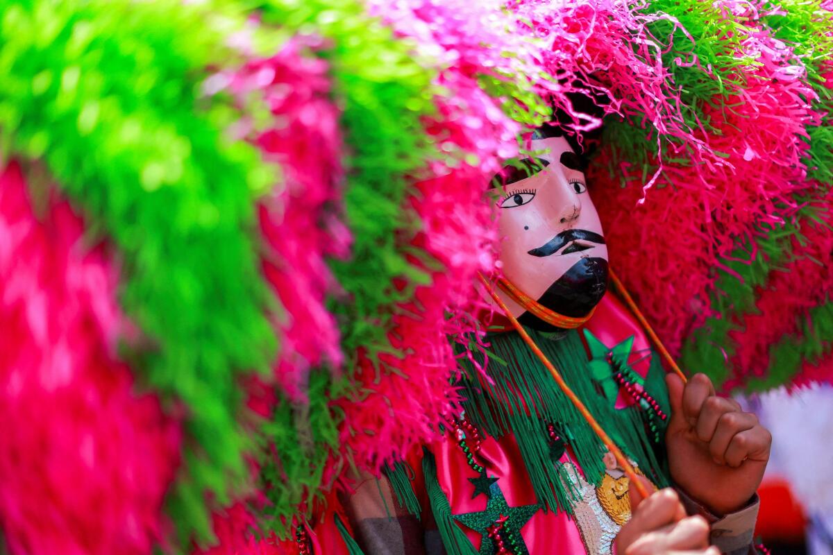 A man dressed as one of "Los Sayones", a local interpretation of the executioners who killed Jesus, participates in a procession during Good Friday celebrations in Tetela del Volcan, state of Morelos, Mexico