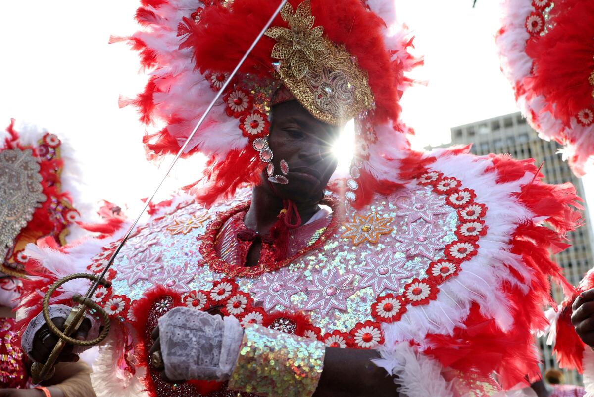 A person takes part in the Lagos Fanti Carnival to celebrate the Afro-Brazilian colours and rhythm, to bring into memory the descendants of formerly enslaved Africans, in Marina, Lagos Island, Nigeria