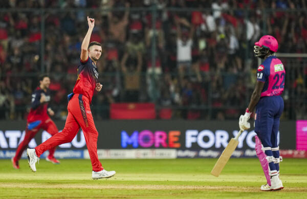 Royal Challengers Bengaluru's Josh Hazlewood celebrates the wicket of Rajasthan Royals' Jofra Archer during the Indian Premier League (IPL) 2025 cricket match between Royal Challengers Bengaluru and Rajasthan Royals, at M Chinnaswamy stadium in Bengaluru, Thursday. 