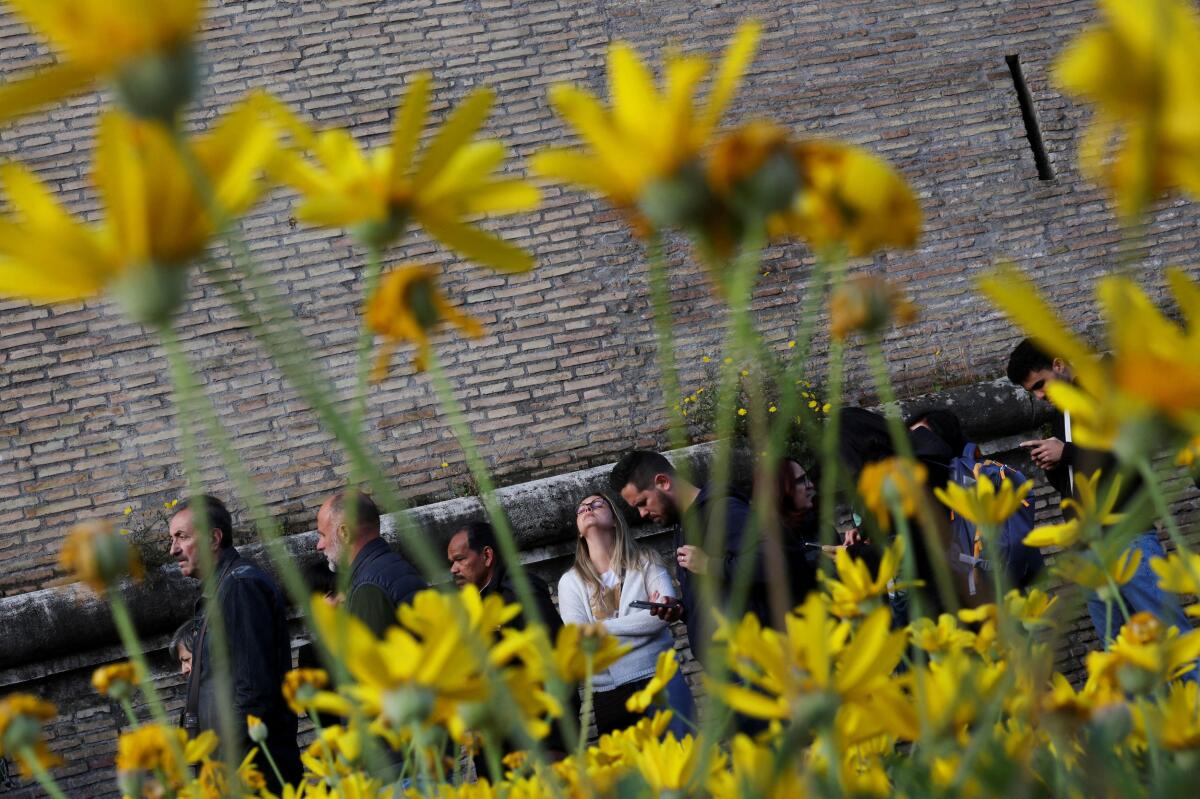 People wait in a queue outside Vatican City, as Pope Francis lies in state in St. Peter's Basilica, in Rome, Italy April 24, 2025. 